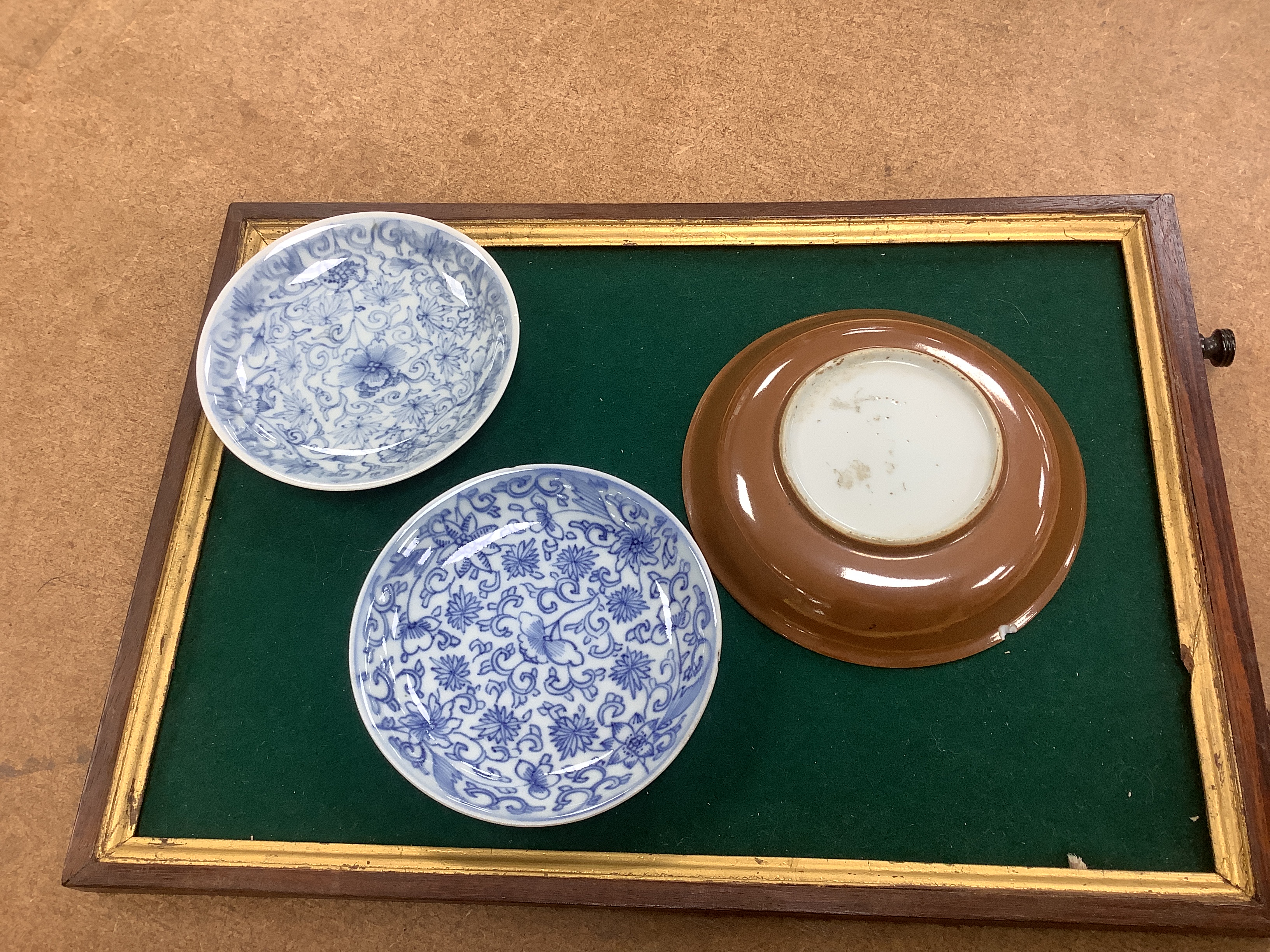 A set of six Chinese blue and white tea bowls and saucers, Kangxi period, a Chinese famille rose tea bowl and saucer, a Batavia ware saucer, both 18th century and Japanese ceramics